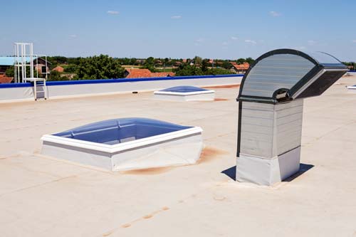 Commercial roof flat with sky windows.