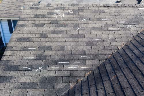 Roof with chalk marking where the damaged is at.